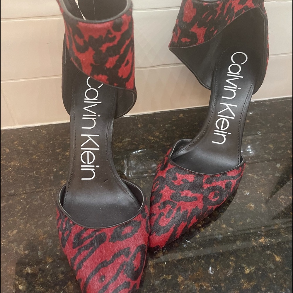 Beautiful red and black cheetah zip-up pumps.   Excellent condition!!